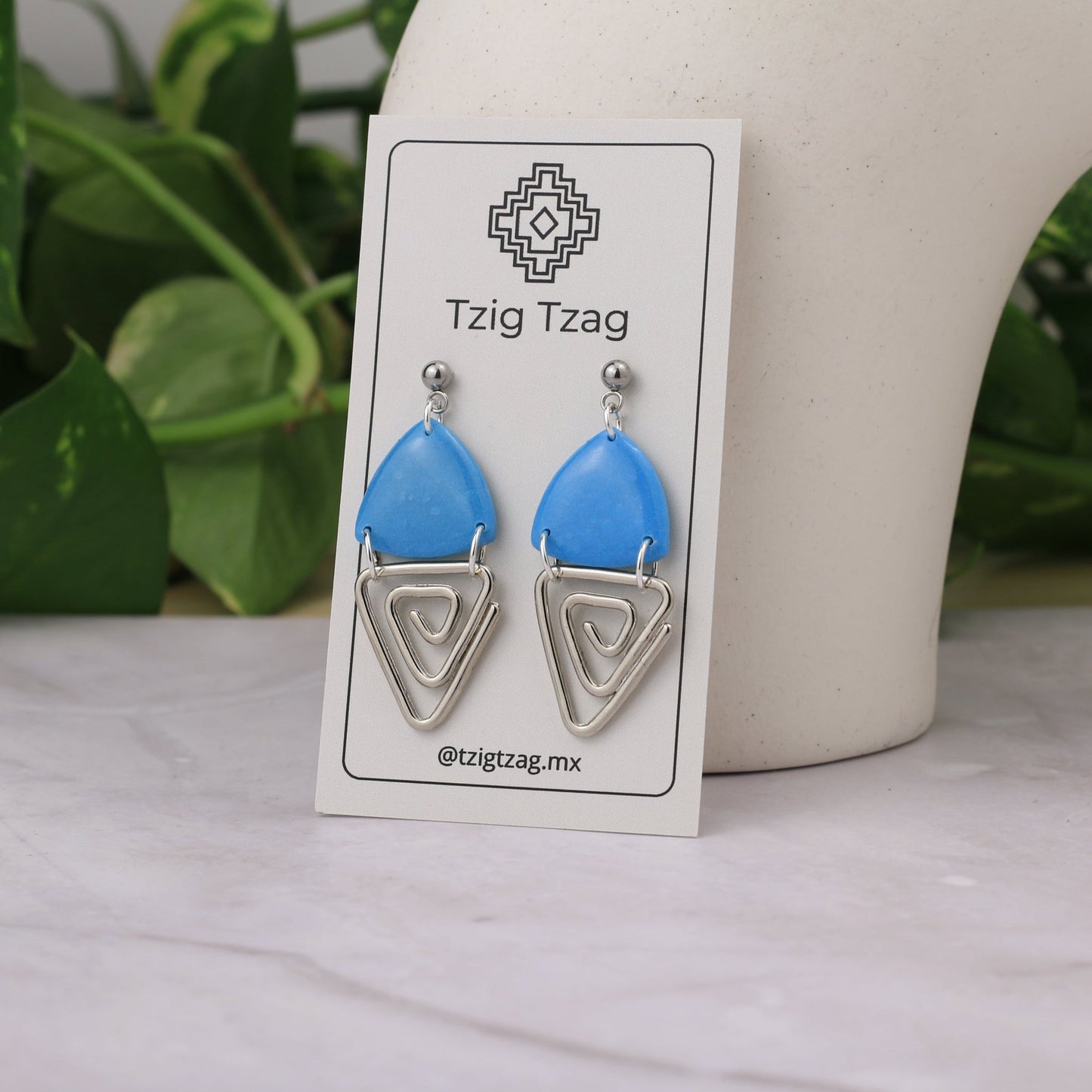 Aretes Jano Plateados - Tzig Tzag Joyería - Color Azul Claro